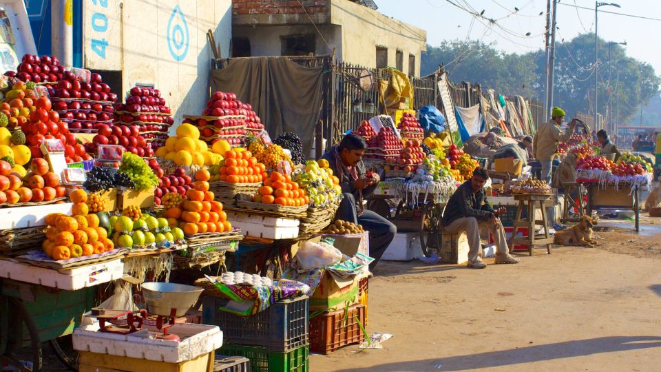 Delhi: Old Delhi City Tour with Tuk-Tuk Ride & Street Food - India Gate and the Parliament Buildings pass-by